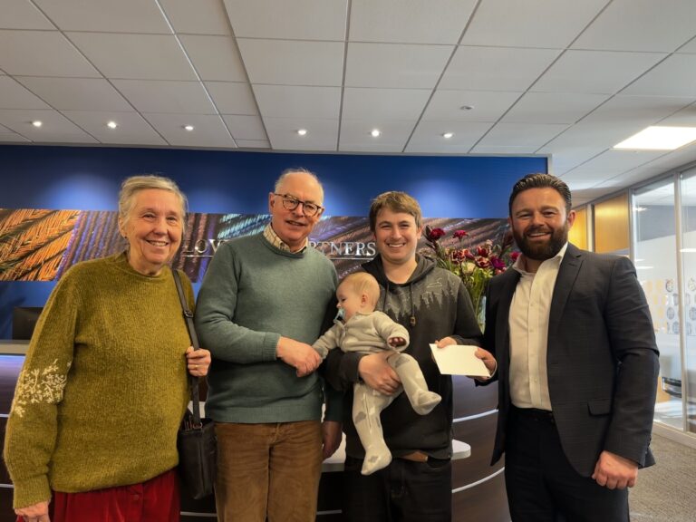 Photo Competition winner Jordan Eva receiving his prize from Loveday & Partners